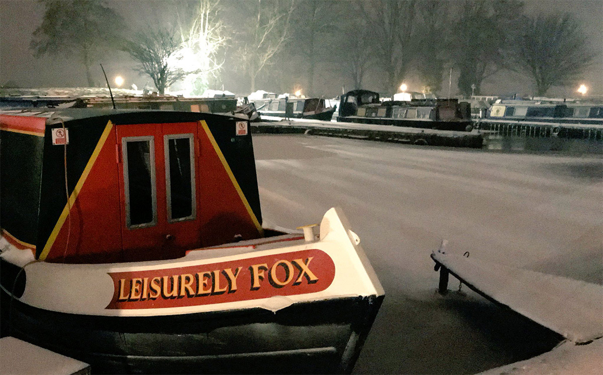 narrowboat fox during winter